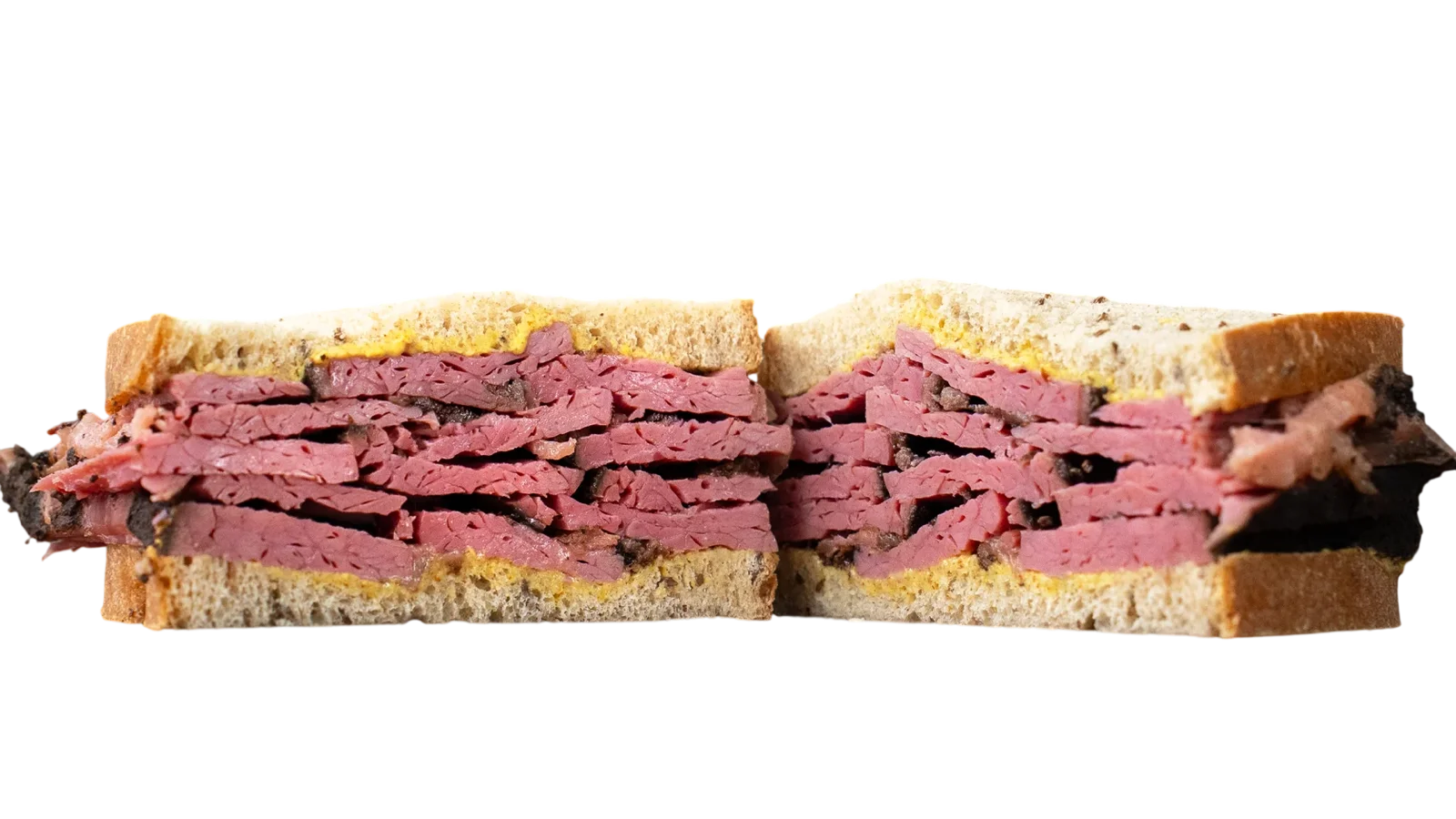 Hand-cut pastrami piled on rye, cut in half